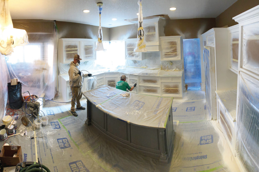 House painters painting a cedar sided home in Minneapolis