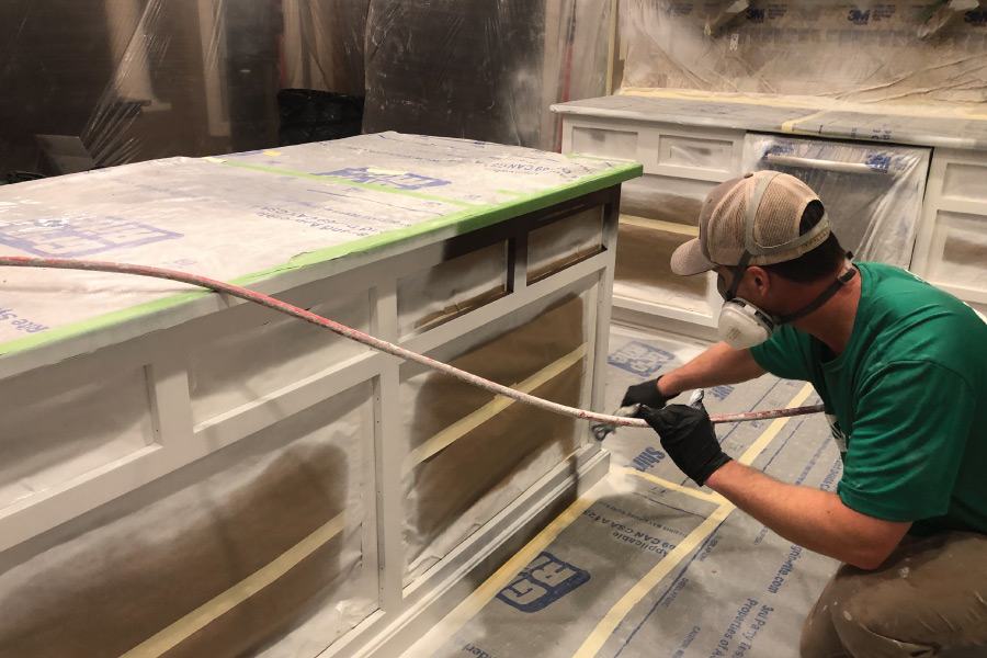 Covering exterior windows with plastic before painting